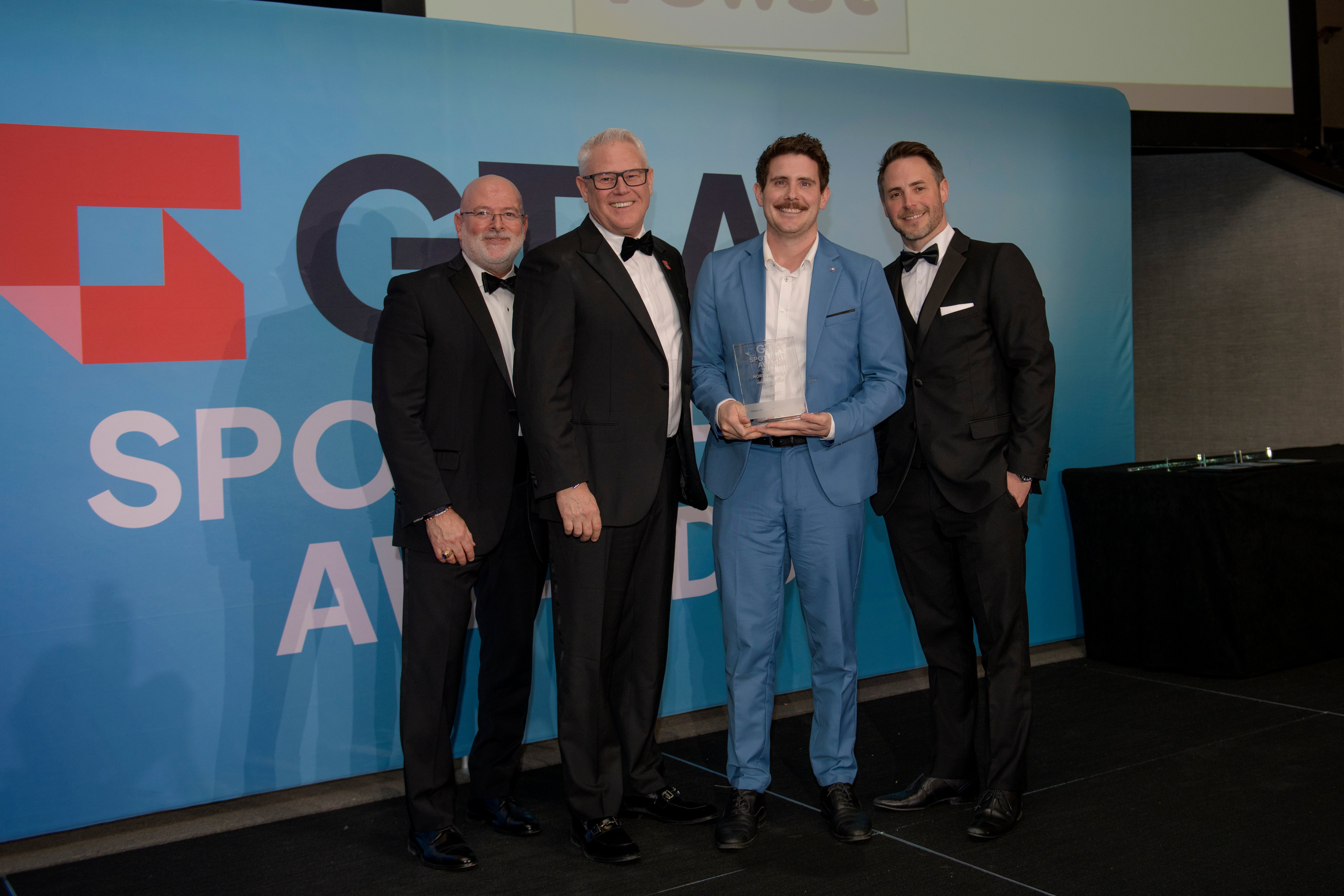 Rewst accepts the GTIA Spotlight Award