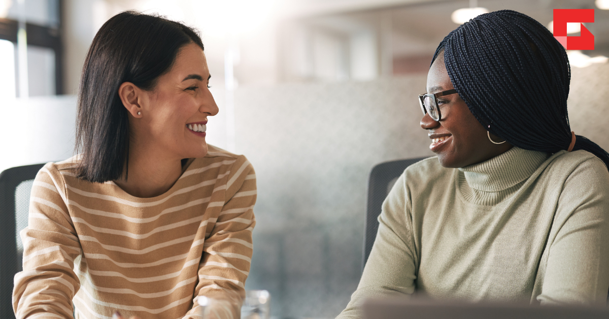 Two women having a close conversation.