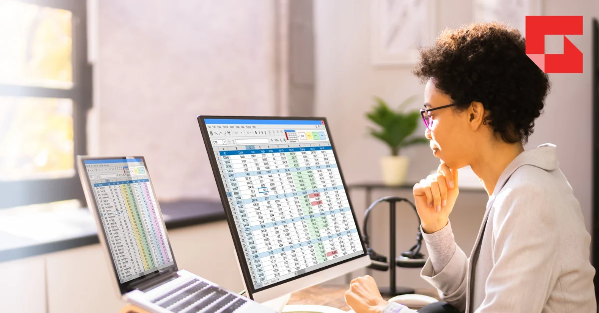 Woman looking at numbers on a computer screen