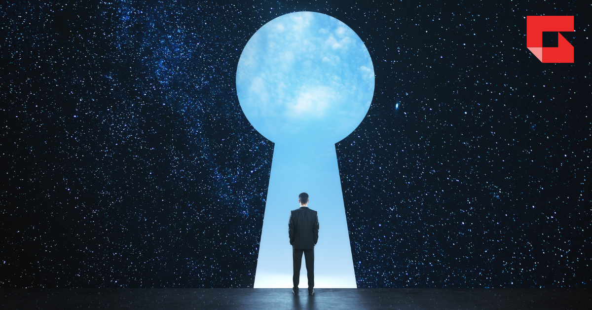Shadow of man standing in front of a keyhole shape looking into a blue sky