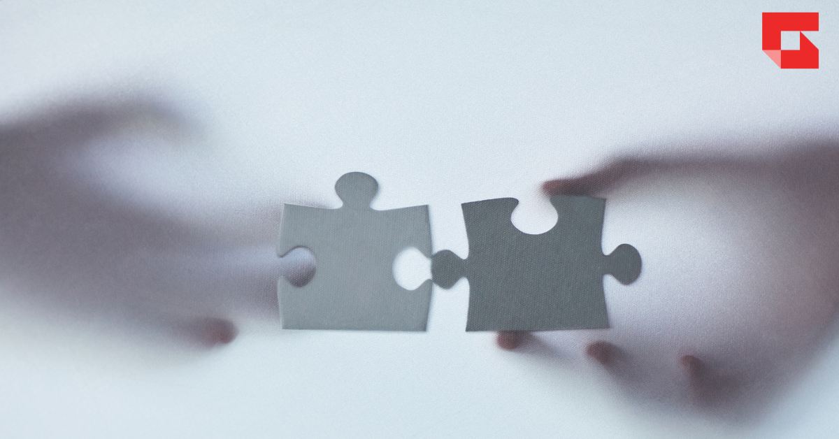 Two puzzle pieces fitting together