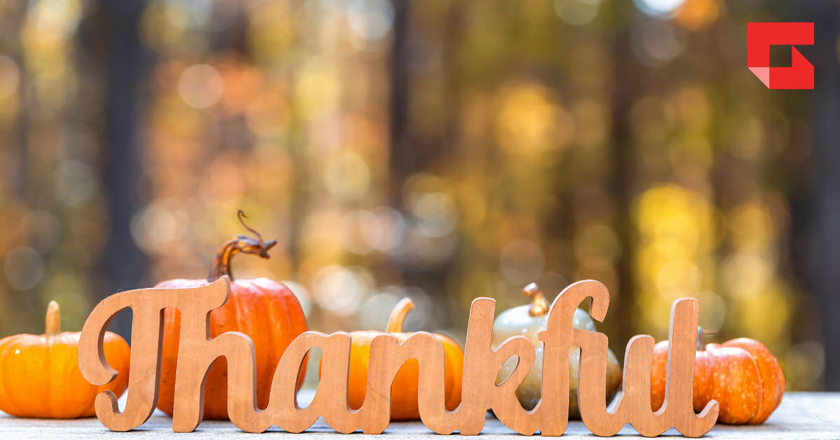 The words thankful with a Thanksgiving background
