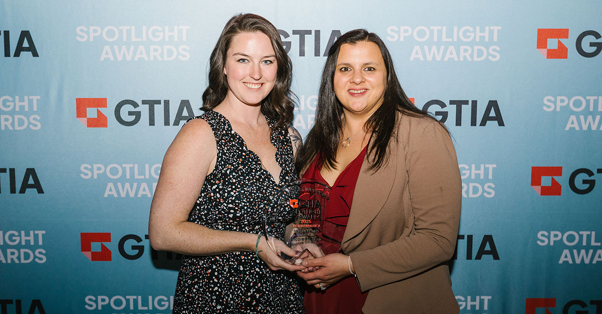 Abi Walsh, CRO, and Dyanna Tropea, operations manager and consultant of Encore Strategic accept the GTIA Spotlight Award.
