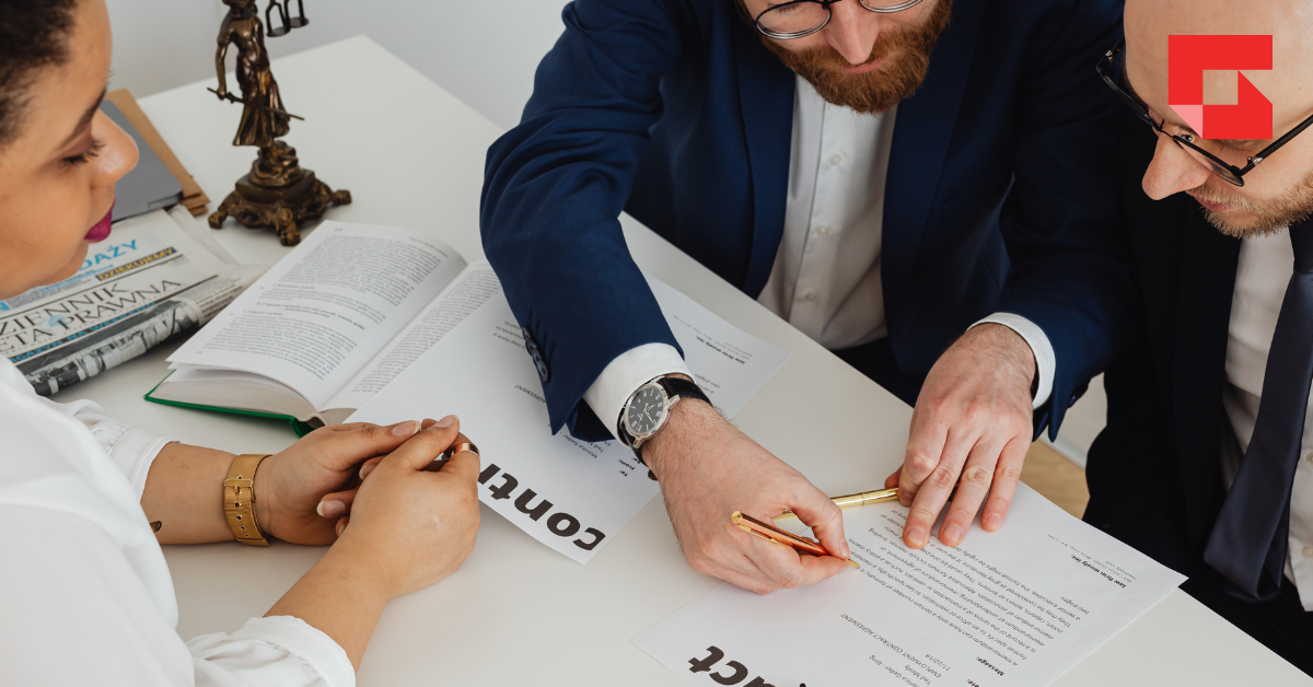 image of hands completing a contract