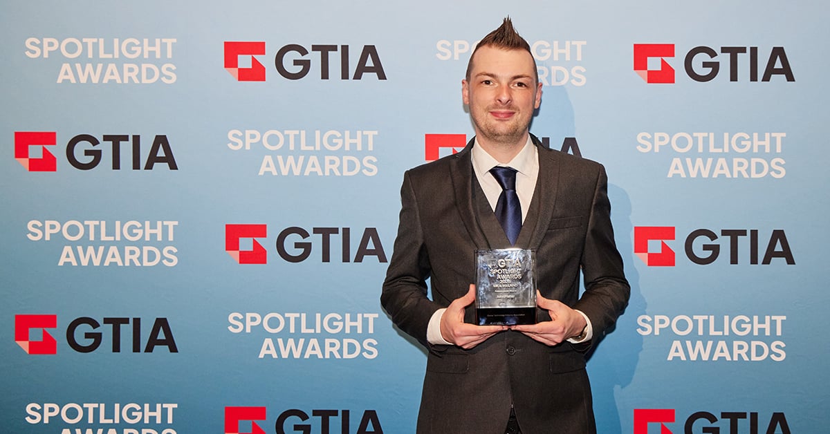 John Fisher accepts the GTIA Spotlight Award