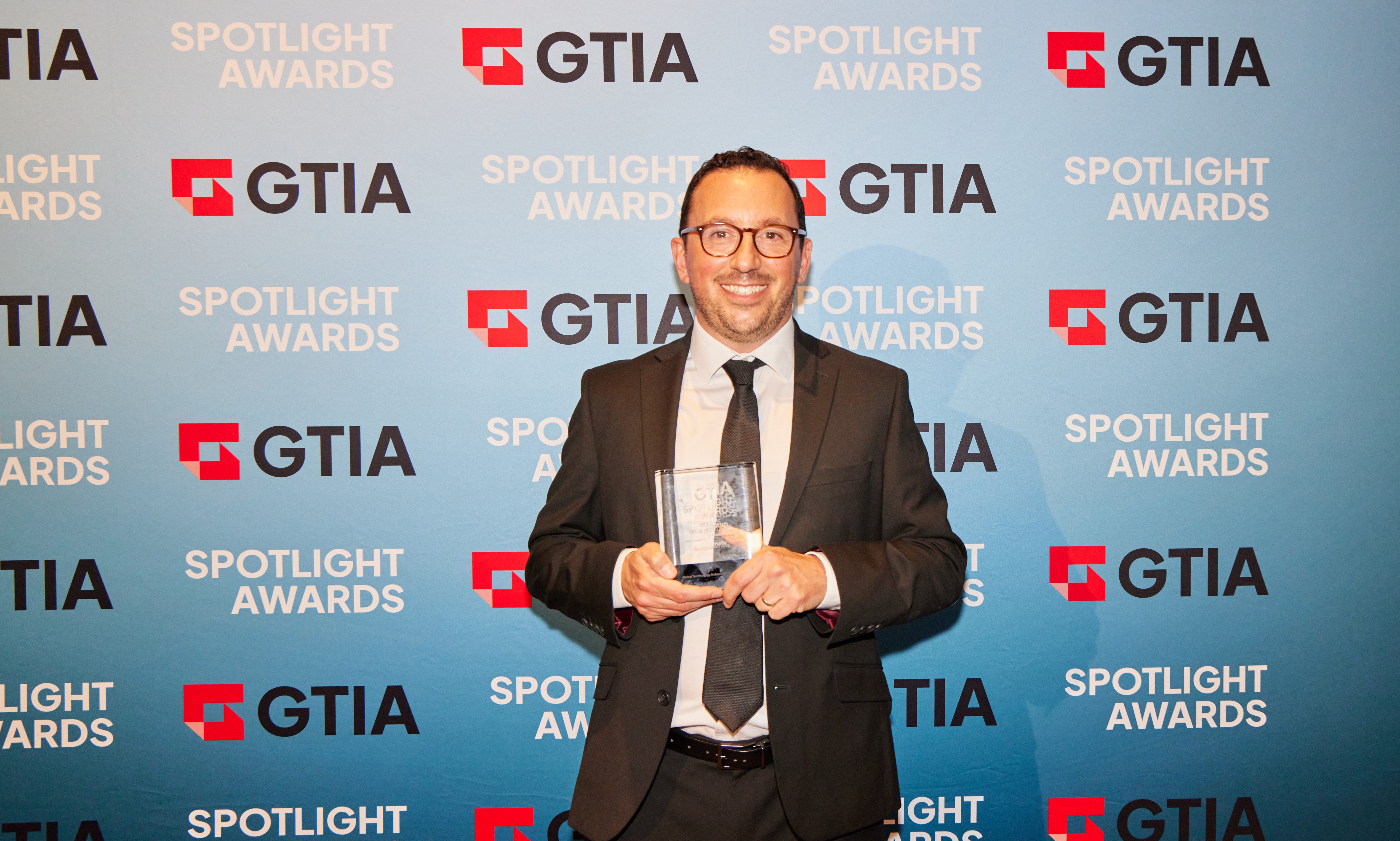 Jamie Claret accepts the GTIA Spotlight Award.