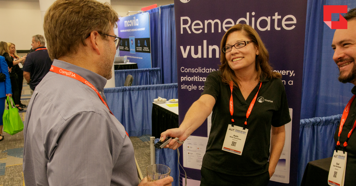 Vendor at ChannelCon scanning a badge of an attendee