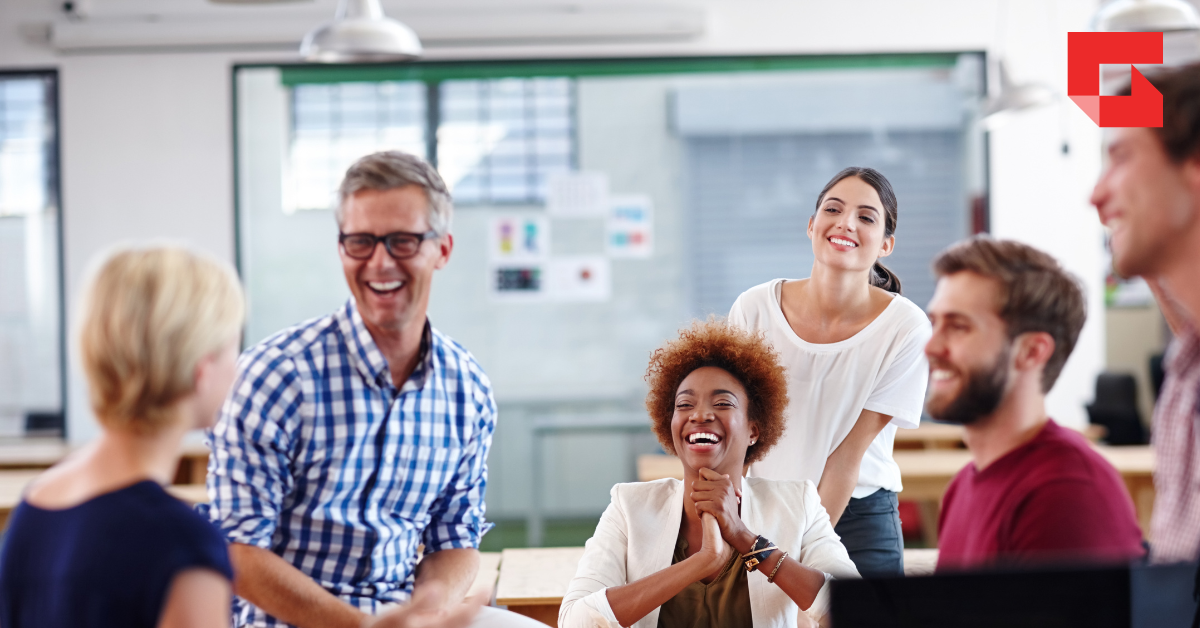 Group of employees talking and laughing